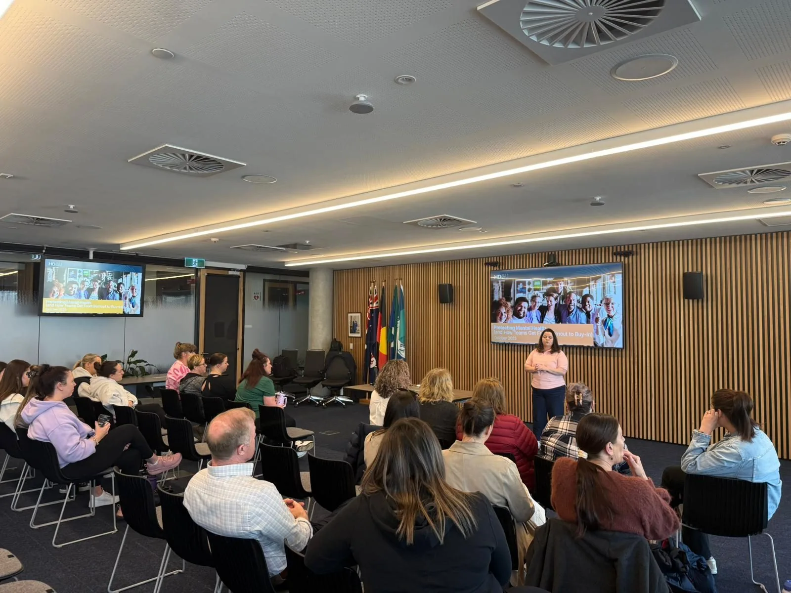 Apex trainer presenting to a seated workshop audience